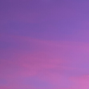photograph of purple and pink sky with moon
